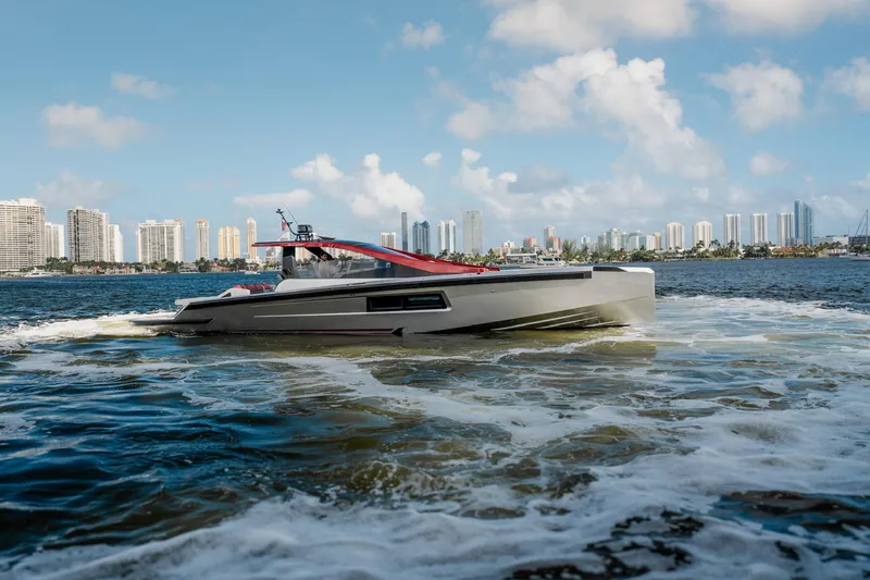 The Image of Luxury Maori 54XL yacht cruising near city skyline, 2025 model. - 0
