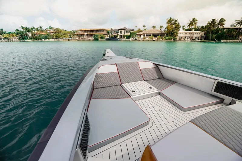 Slide: The Image of Luxury Maori 54XL yacht deck, 2025 model, with elegant seating and scenic waterfront view. - 12