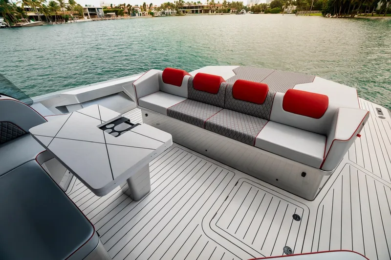 Slide: The Image of Luxurious 2025 Maori 54XL yacht deck with stylish seating and scenic waterfront view. - 14