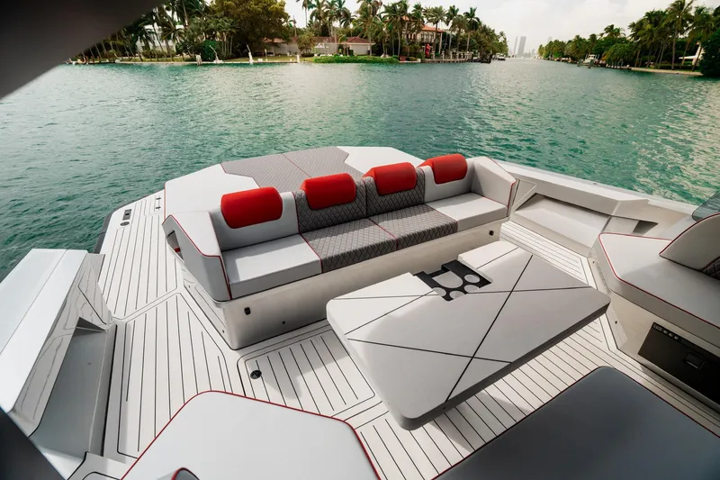 Slide: The Image of Luxurious 2025 Maori 54XL yacht deck with modern seating and scenic waterfront view. - 15