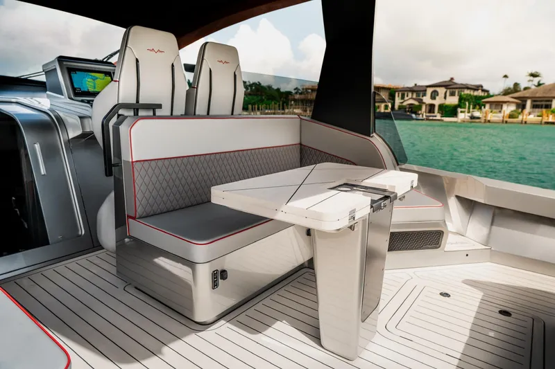 Slide: The Image of Luxurious interior of 2025 Maori 54XL yacht with modern seating and table design. - 19