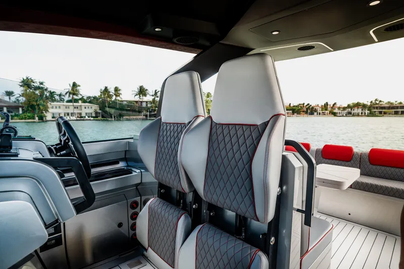 Slide: The Image of Luxurious interior of 2025 Maori 54XL yacht with modern seating and scenic waterfront view. - 20