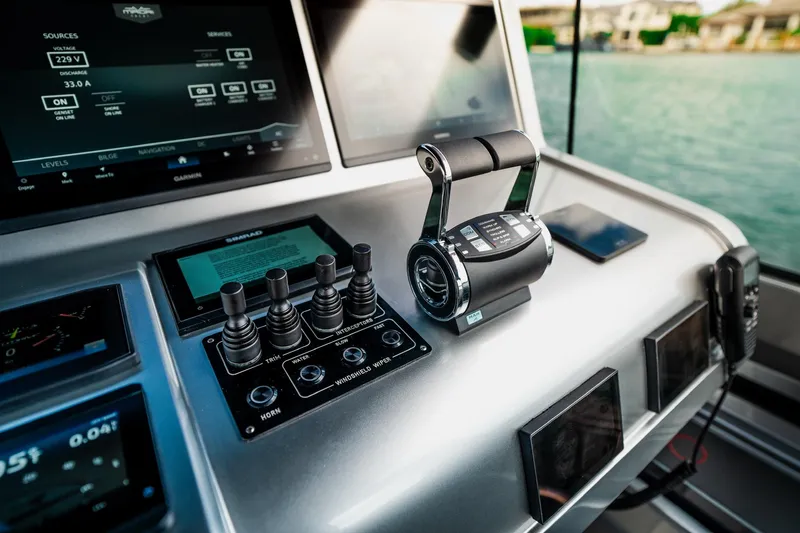 Slide: The Image of Control panel of a 2025 Maori 54XL yacht with advanced navigation systems. - 21
