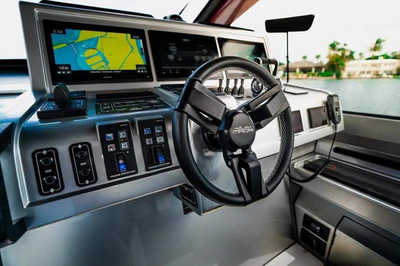 Slide: The Image of Control panel of 2025 Maori 54XL yacht with advanced navigation systems. - 23
