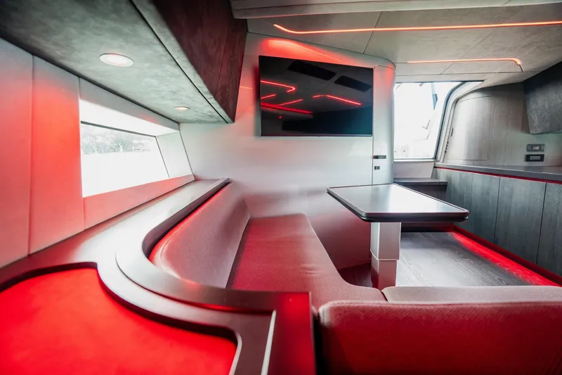 Slide: The Image of Futuristic interior of 2025 Maori 54XL yacht with red LED lighting and modern seating. - 28