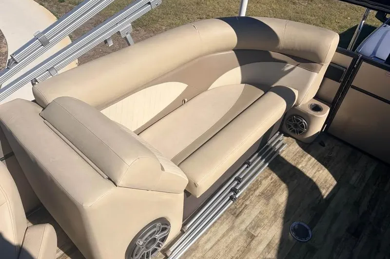 Slide: The Image of 2016 Crest II 230 SLC boat interior with beige seating and speaker system. - 25