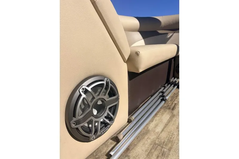 Slide: The Image of 2016 Crest II 230 SLC boat interior with speaker and beige seating. - 27
