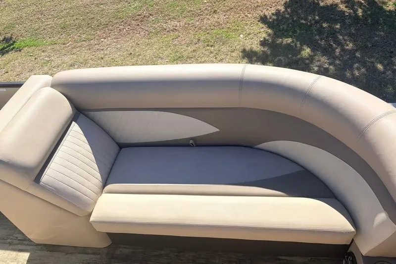 Slide: The Image of 2016 Crest II 230 SLC boat seat, beige upholstery, outdoor setting. - 6
