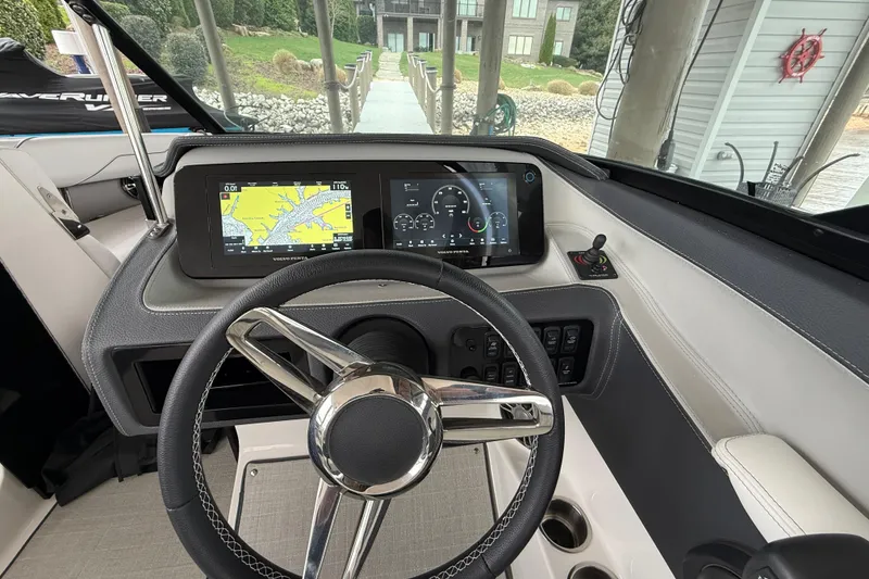 Slide: The Image of 2024 Regal LS4 boat dashboard with steering wheel and digital displays. - 6