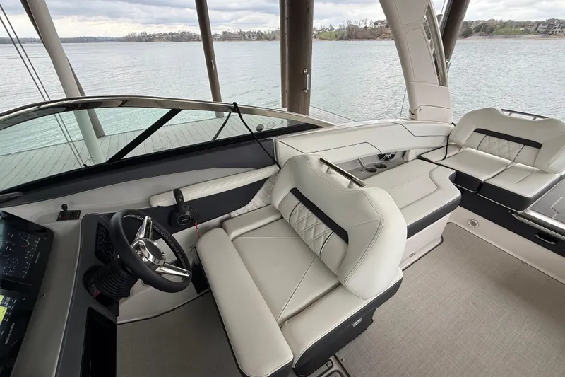 Slide: The Image of 2024 Regal LS4 boat interior with luxurious seating and modern steering console. - 7