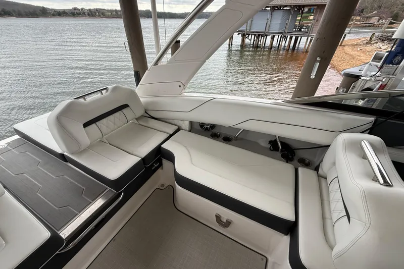 Slide: The Image of Luxurious seating on 2024 Regal LS4 boat, overlooking serene waterfront. - 8