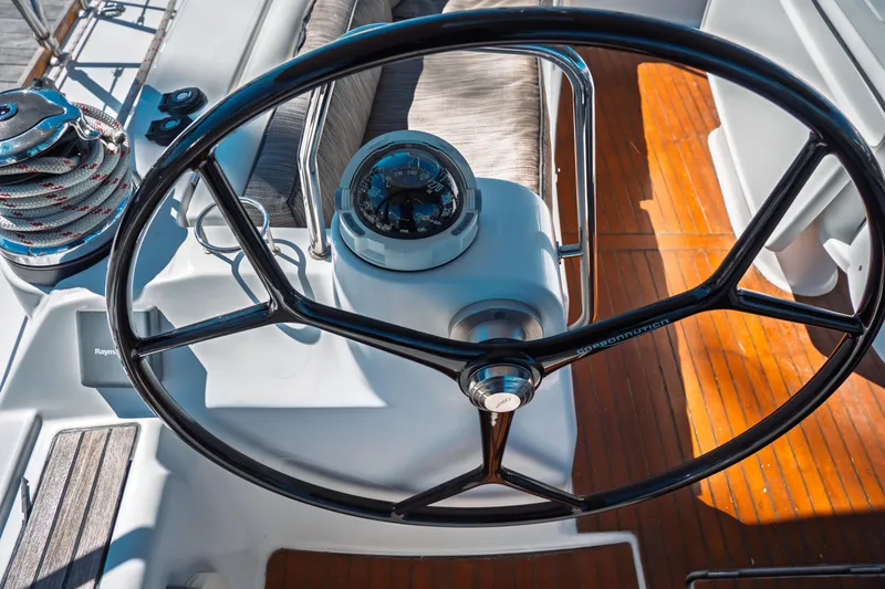 Slide: The Image of Steering wheel of 2011 Beneteau Oceanis 50 yacht with compass and winch. - 13