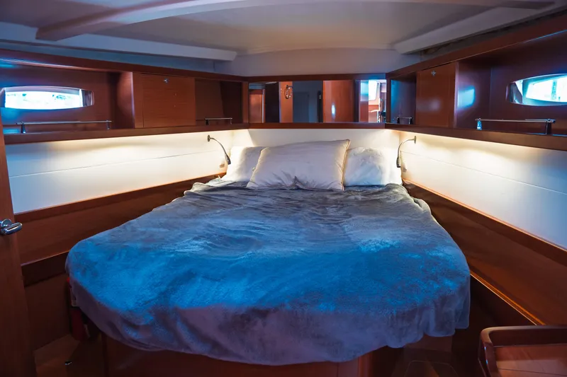 Slide: The Image of Luxurious cabin interior of 2011 Beneteau Oceanis 50 yacht with cozy bedding. - 24