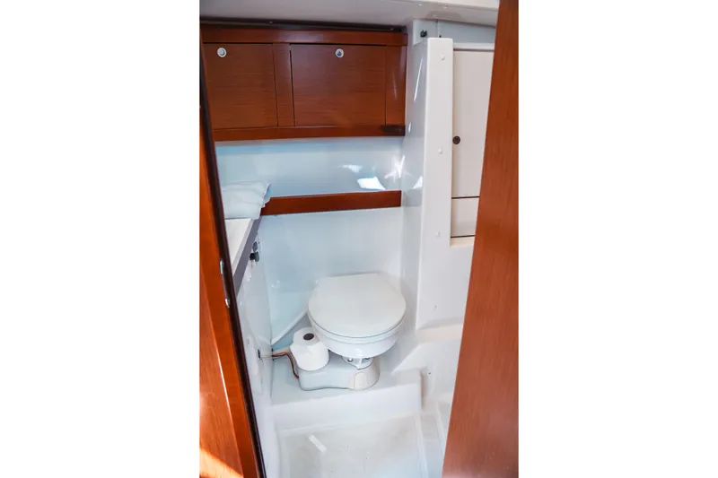 Slide: The Image of Bathroom interior of 2011 Beneteau Oceanis 50 yacht with wooden cabinets. - 27