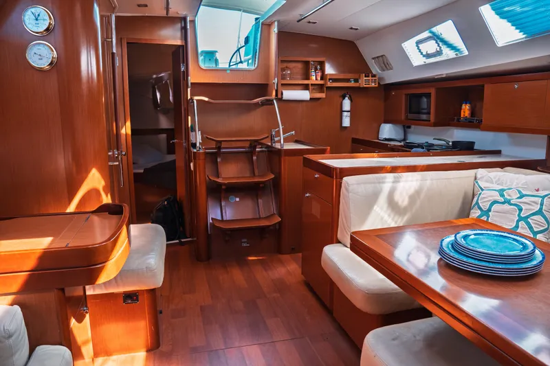 Slide: The Image of Luxurious interior of 2011 Beneteau Oceanis 50 yacht with wood finish and modern amenities. - 34
