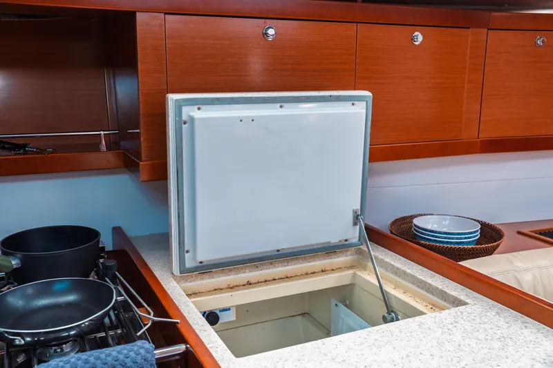 Slide: The Image of Interior of 2011 Beneteau Oceanis 50 yacht kitchen with open storage compartment. - 39