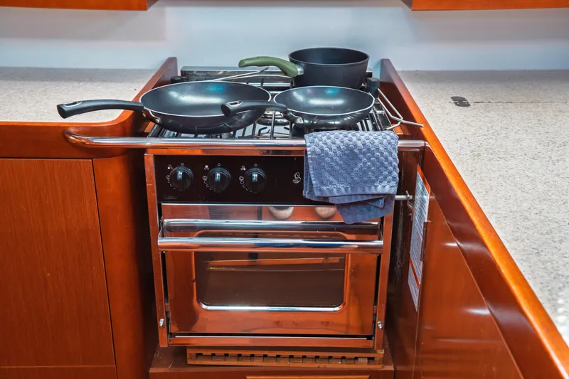 Slide: The Image of Galley kitchen in 2011 Beneteau Oceanis 50 yacht with stove and cookware. - 41