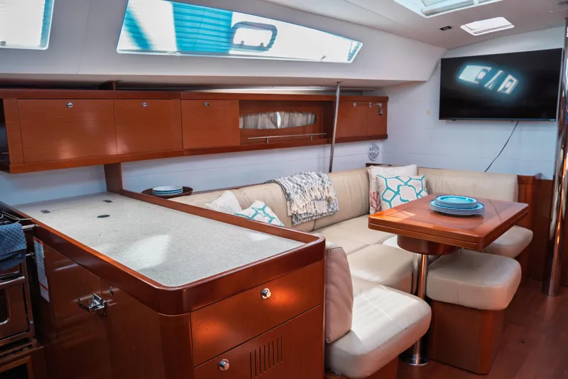 Slide: The Image of Luxurious interior of 2011 Beneteau Oceanis 50 yacht with modern seating and elegant wood finishes. - 43