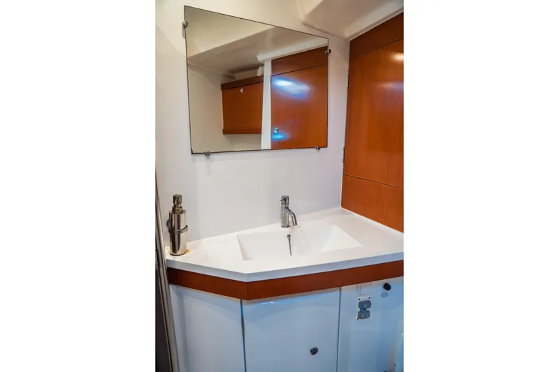 Slide: The Image of Bathroom vanity in 2011 Beneteau Oceanis 50 yacht with mirror and modern sink. - 46