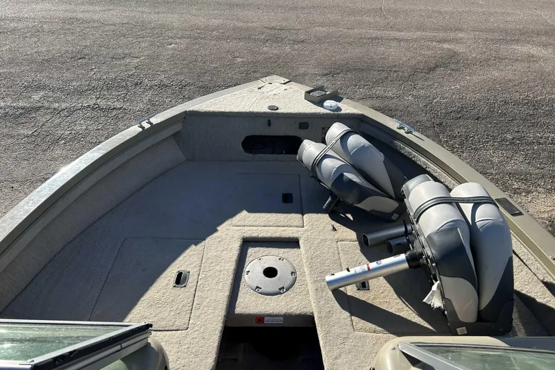 Slide: The Image of 2007 Lowe 175 FS boat interior with seating and storage compartments. - 4