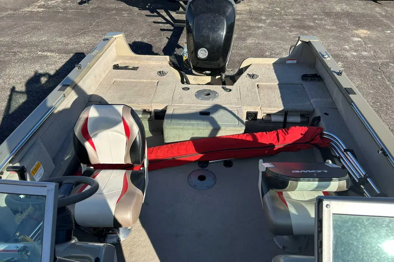 Slide: The Image of 2007 Lowe 175 FS boat interior with seating and storage compartments. - 5