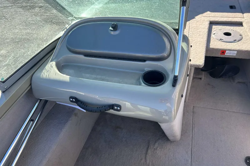 Slide: The Image of 2007 Flowers Lowe 175 FS boat interior with storage compartment and cup holder. - 8