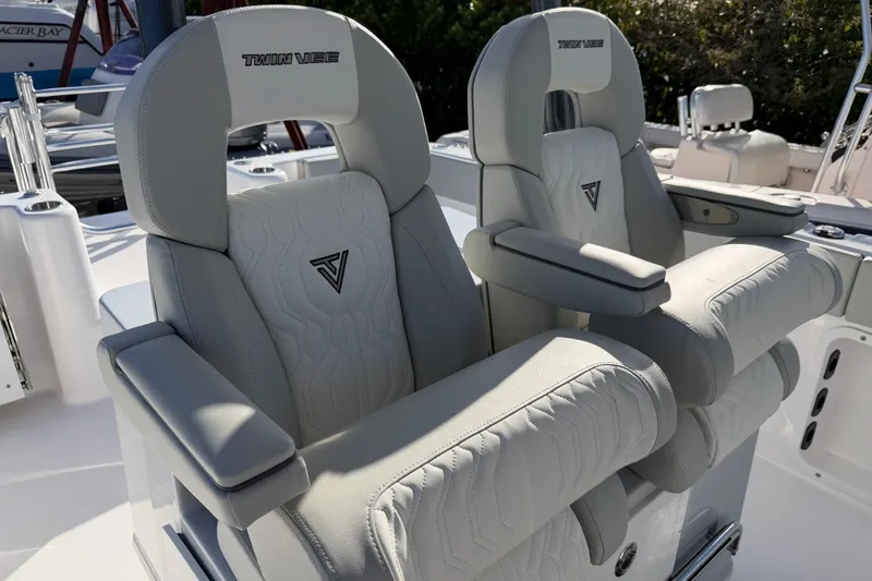 Slide: The Image of Luxury seating on 2026 Twin Vee 280 GFX2 CC boat, featuring plush, embroidered upholstery. - 13