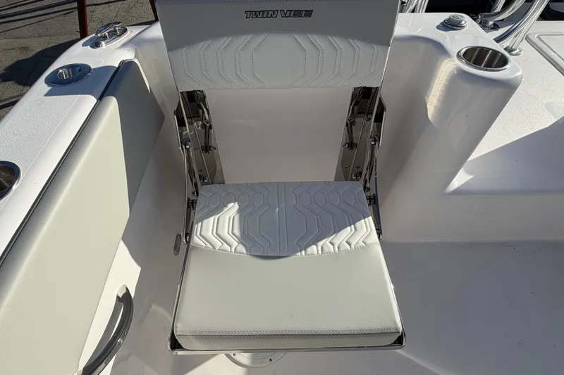 Slide: The Image of White seat on 2026 Twin Vee 280 GFX2 CC boat, featuring cup holders and sleek design. - 14