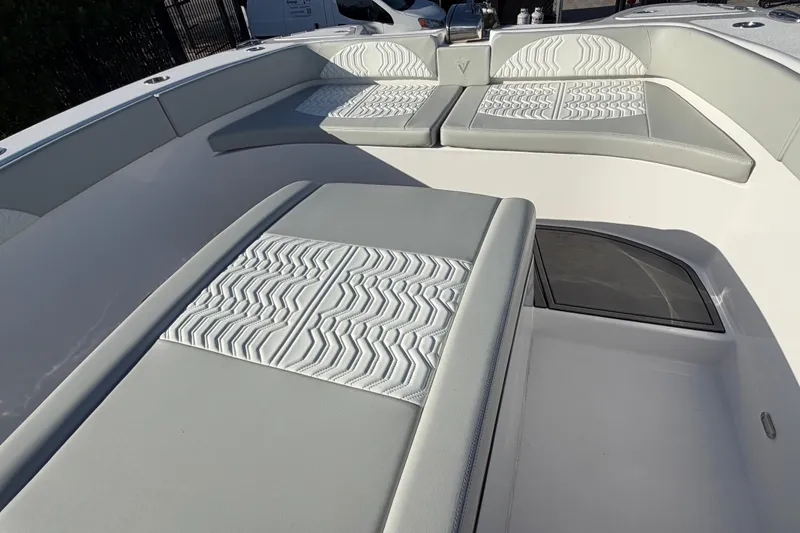 Slide: The Image of Interior of 2026 Twin Vee 280 GFX2 CC boat, featuring a compact marine toilet. - 20