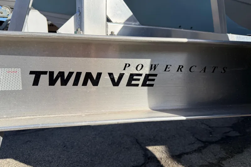 Slide: The Image of 2026 Twin Vee 280 GFX2 CC boat logo on white surface. - 26