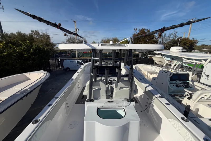 Slide: The Image of 2026 Twin Vee 280 GFX2 CC boat, center console, docked with fishing rods. - 5