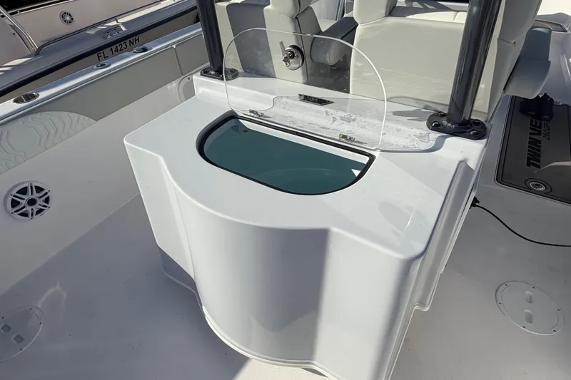 Slide: The Image of 2026 Twin Vee 280 GFX2 CC boat interior with seating and storage area. - 9