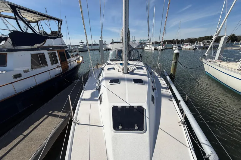 Slide: The Image of Sailboat Catalina 380, 1998 model, docked at marina with clear blue sky. - 1