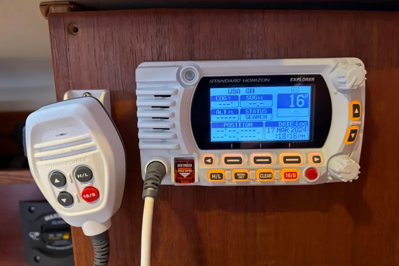 Slide: The Image of VHF radio system on 1998 Catalina 380 sailboat, featuring Standard Horizon Explorer display. - 15