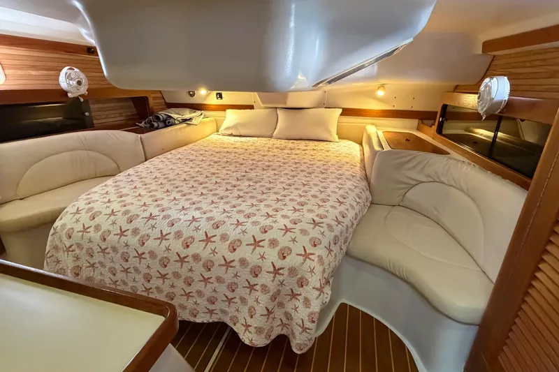 Slide: The Image of Cozy interior of 1998 Catalina 380 yacht with comfortable bed and elegant wood paneling. - 27