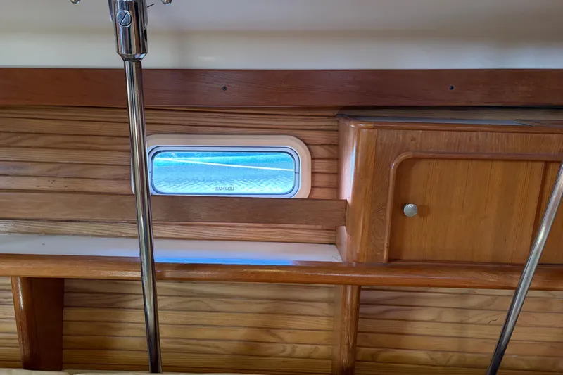 Slide: The Image of Interior of a 1998 Catalina 380 yacht with wooden paneling. - 32