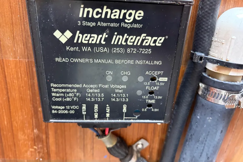 Slide: The Image of Heart Interface alternator regulator on Catalina 380, 1998 model, with voltage settings and instructions. - 46