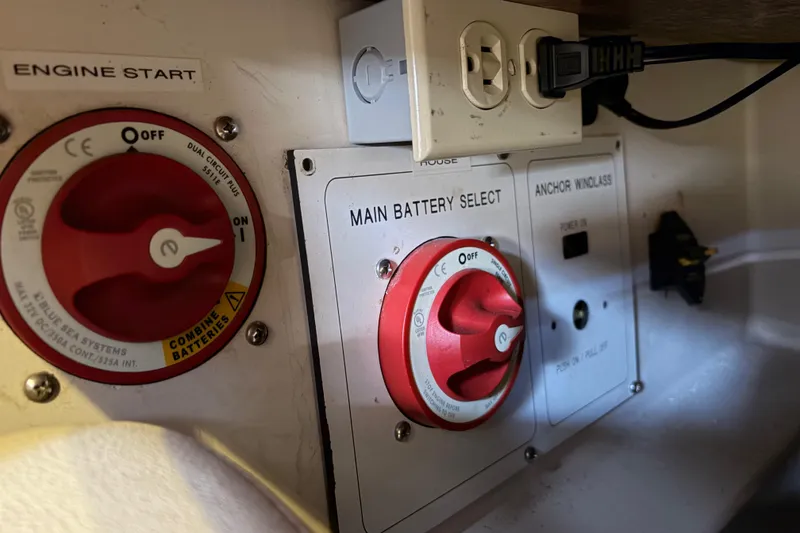 Slide: The Image of Battery control panel on a 1998 Catalina 380 sailboat, featuring engine start and main battery select. - 47