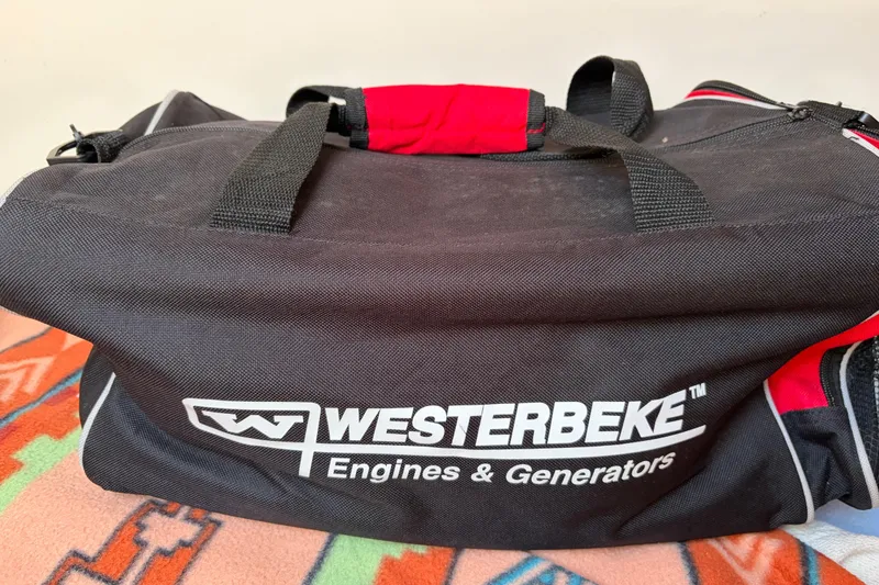 Slide: The Image of Black Westerbeke bag on colorful blanket, Catalina 380, 1998 model. - 48