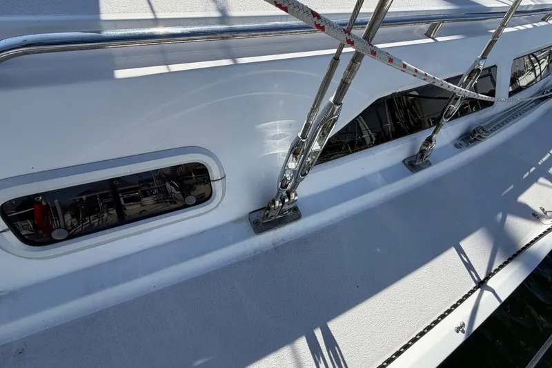 Slide: The Image of Close-up of 1998 Catalina 380 yacht deck with rigging and windows. - 57
