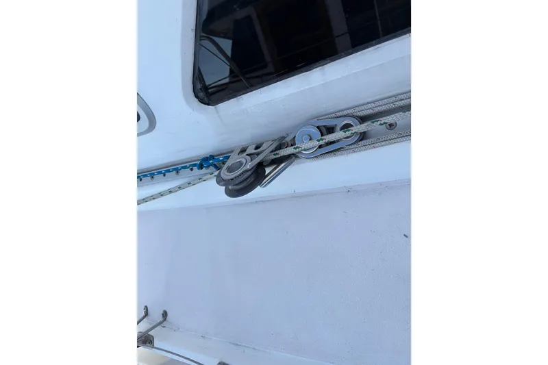 Slide: The Image of Rope and pulley system on a 1998 Catalina 380 sailboat deck. - 62