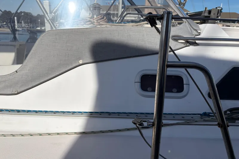 Slide: The Image of Catalina 380 sailboat, 1998 model, featuring deck details and stainless steel railings. - 63