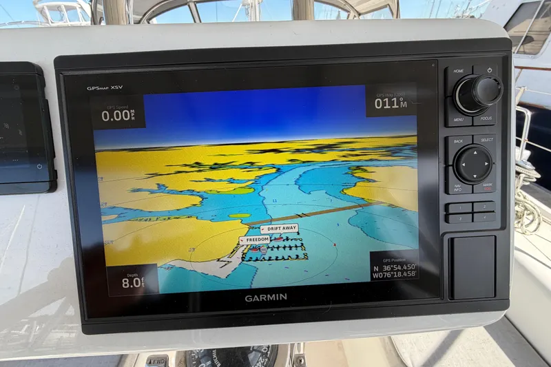 Slide: The Image of Garmin GPS display on 1998 Catalina 380 sailboat, showing nautical map and navigation details. - 68