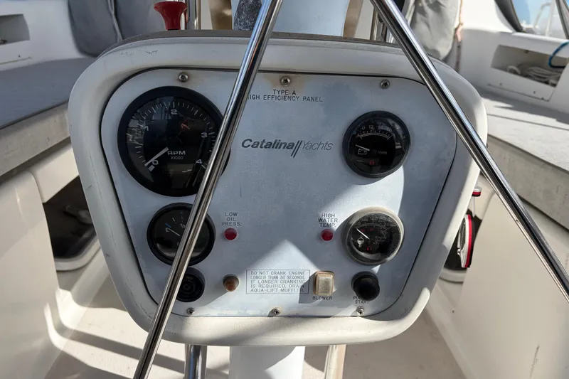 Slide: The Image of Control panel of a 1998 Catalina 380 yacht with gauges and indicators. - 71