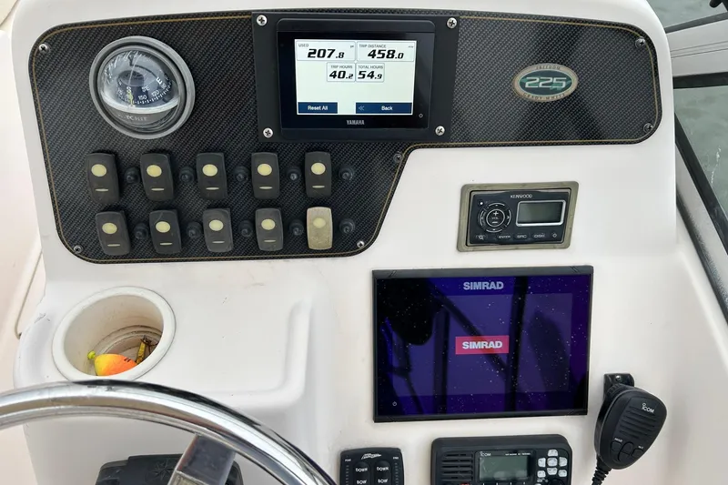 Slide: The Image of Control panel of 2011 Grady-White Freedom 225 boat with navigation and communication systems. - 10