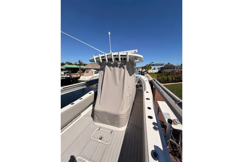 Slide: The Image of 2023 Cape Horn 32 XS boat docked under clear blue sky. - 13