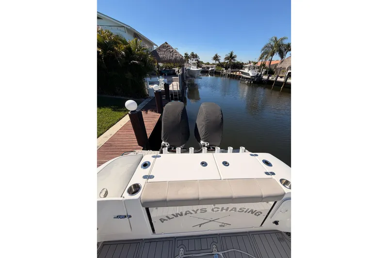 Slide: The Image of 2023 Cape Horn 32 XS boat docked in a scenic canal setting. - 14