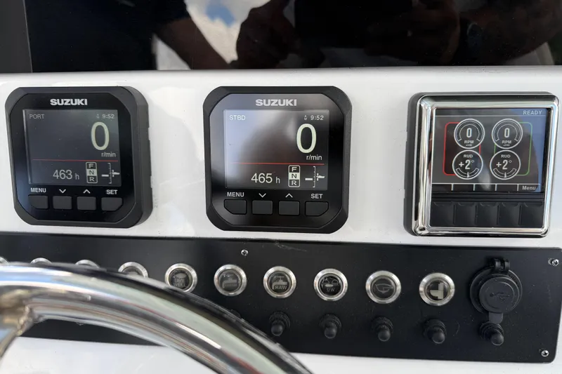 Slide: The Image of Dashboard of 2023 Cape Horn 32 XS boat with Suzuki engine displays. - 21