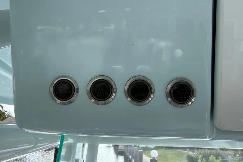 Slide: The Image of Control panel of 2023 Cape Horn 32 XS boat with four buttons. - 22