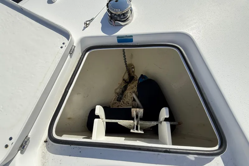 Slide: The Image of Open anchor compartment on 2023 Cape Horn 32 XS boat deck. - 28